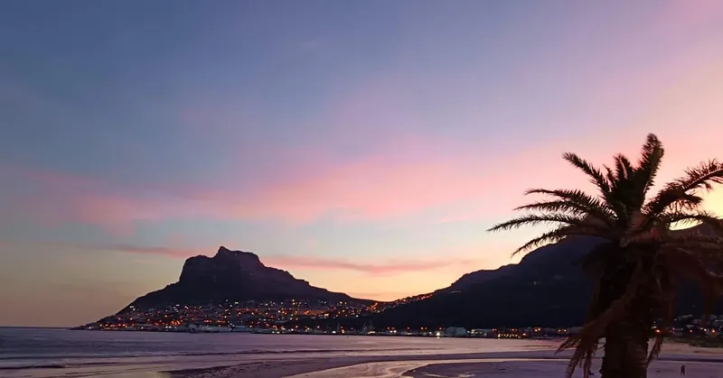 Sunset over the Sentinel from Hout Bay beach